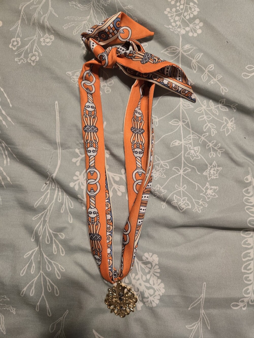 Ransom Orange Patterned Silk Scarf Necklace with Gold Medallion